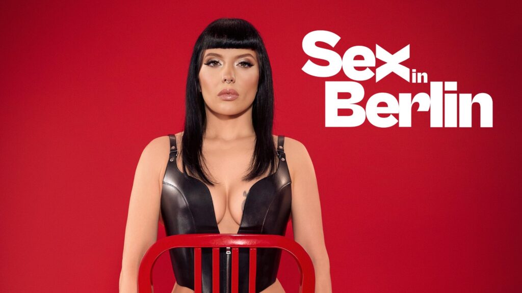 Promotional poster: woman with black hair in a black leather outfit sits behind a red chair against a solid red background with large white 'Sex in Berlin' text on the right